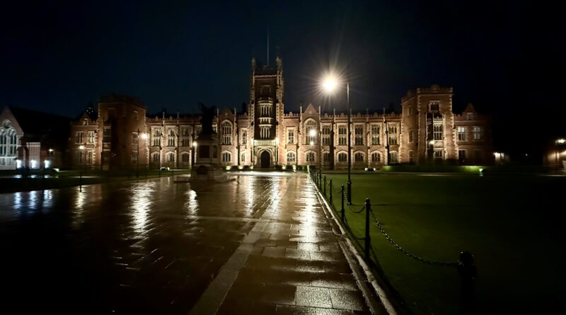Queen's University Belfast illuminated at night