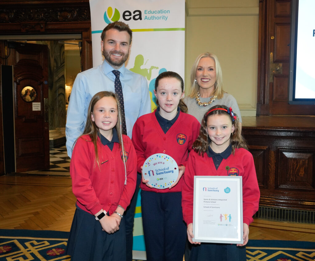 Eve Bremnar presenting Saints and Scholars Integrated Primary School with its award