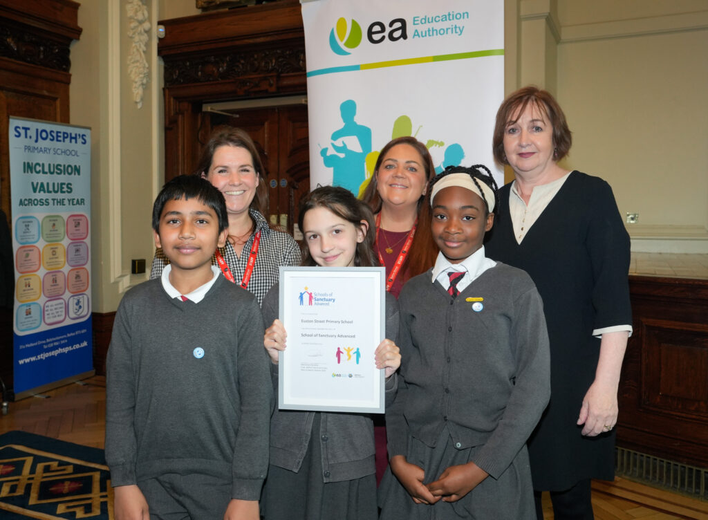 Una Turbitt presenting Euston Street Primary School with its award