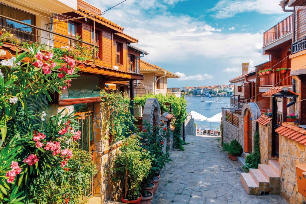 Sozopol Old Town in Bulgaria, showing traditional buildings and a cobbled street overlooking the Black Sea