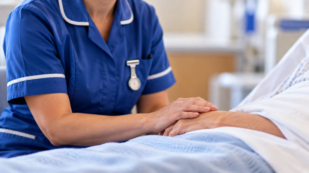 Nurse caring for a patient at their bedside during Northern Ireland nurses pay dispute