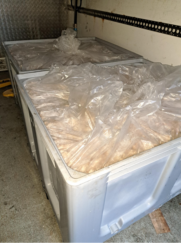 Crates containing frozen meat products associated with the concealed cocaine shipment discovered in Jonesborough