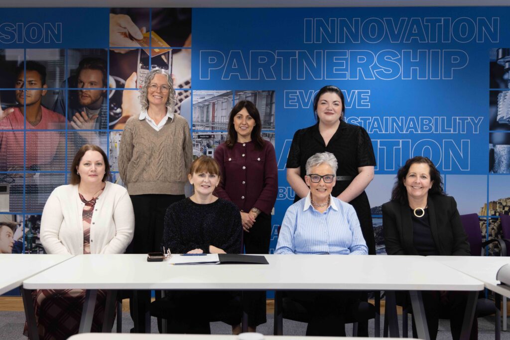 Economy Minister Caoimhe Archibald with members of the Domestic Abuse Safe Leave Working Group