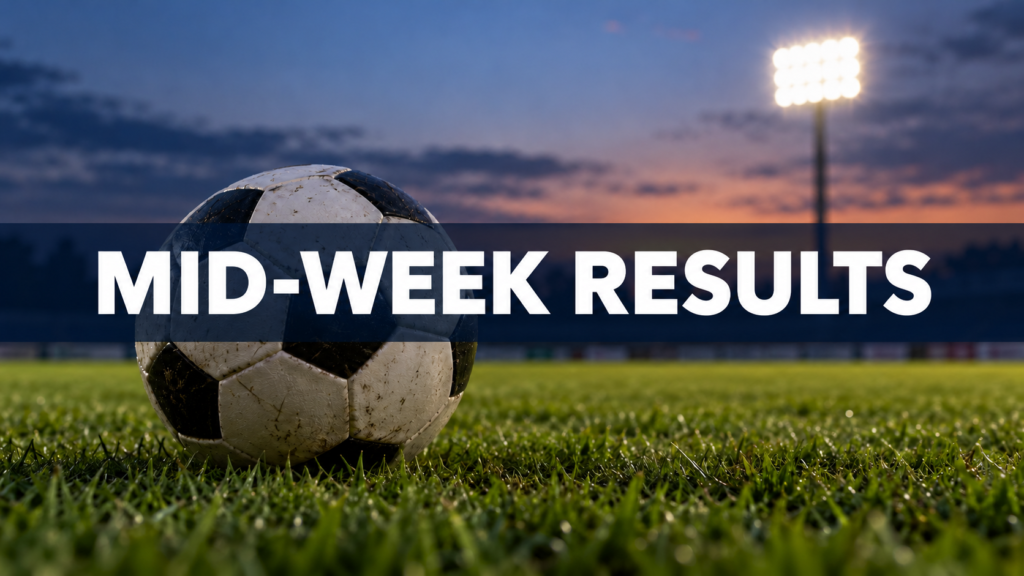 Football on grass under a blurred floodlight with “Mid-Week Results” text