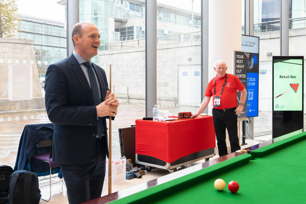 Communities Minister Gordon Lyons taking part in the 10-reds snooker challenge at Belfast's Waterfront Hall during the Northern Ireland Open
