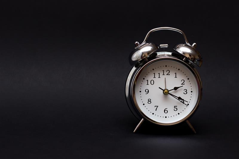 Alarm clock illustrating NI Water's winter support reminder as clocks go back in Northern Ireland