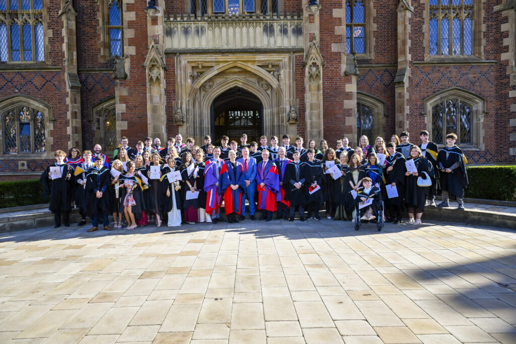 Queen's youth academy graduates gathered outside Queen's University Belfast