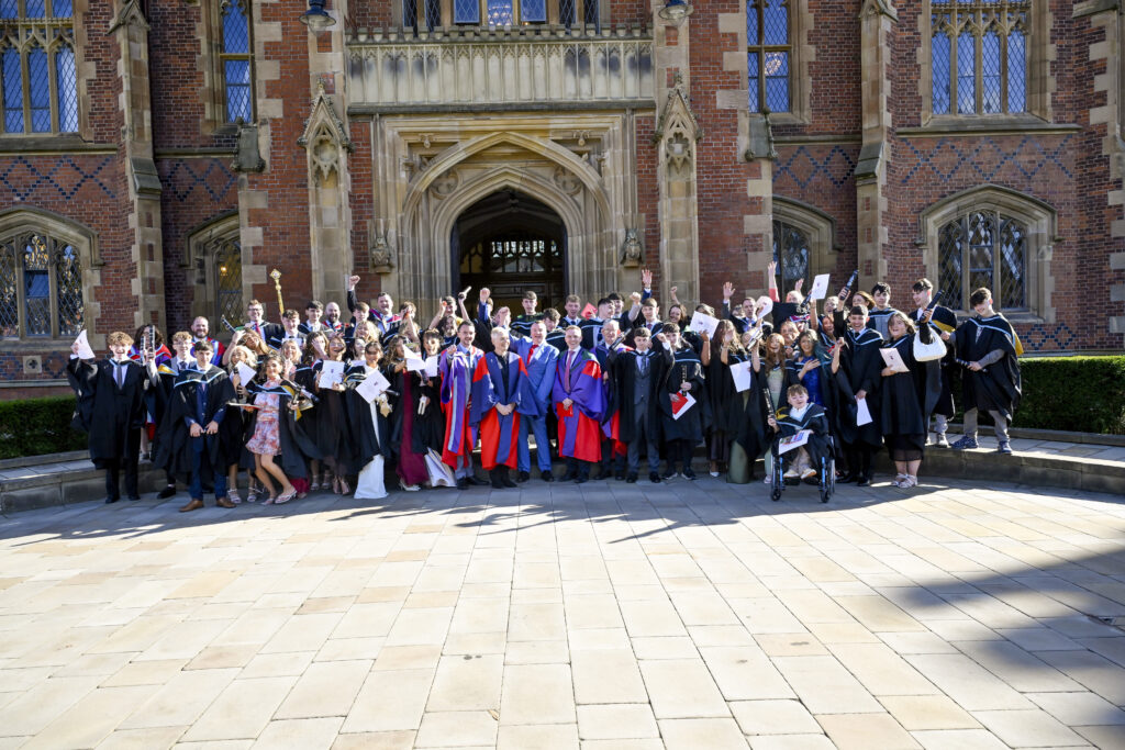 Young R-CITY graduates celebrating outside Queen's University Belfast
