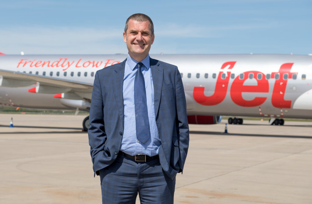 Steve Heapy, Chief Executive Officer of Jet2, standing in front of a Jet2 aircraft
