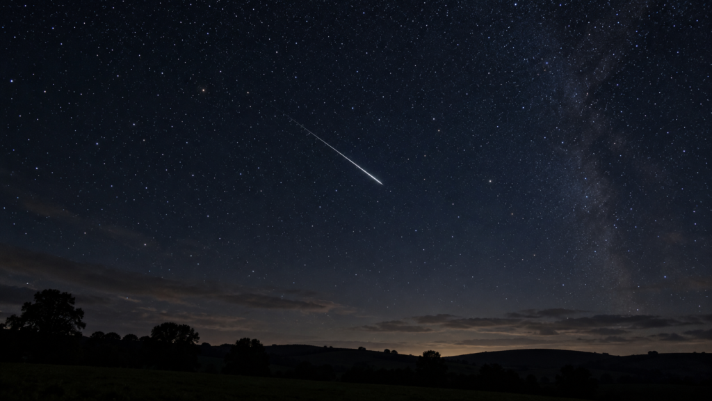 Illustration of a meteor crossing a starry autumn night sky