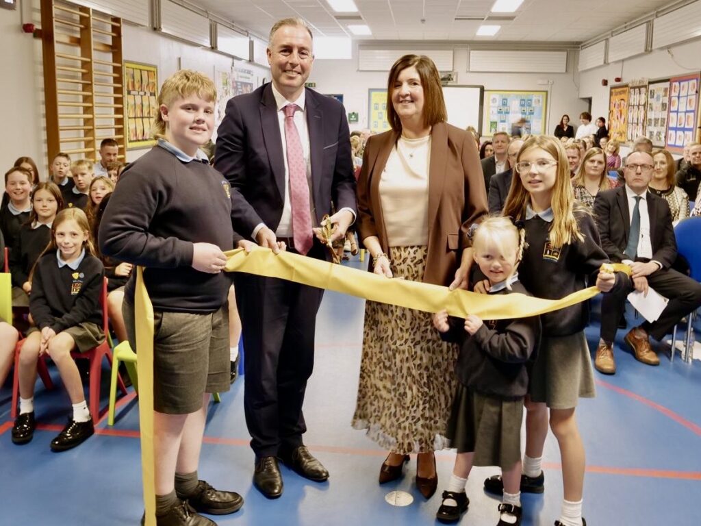 Education Minister Paul Givan with Principal Deborah Mitchell and pupils at Killyman Primary School