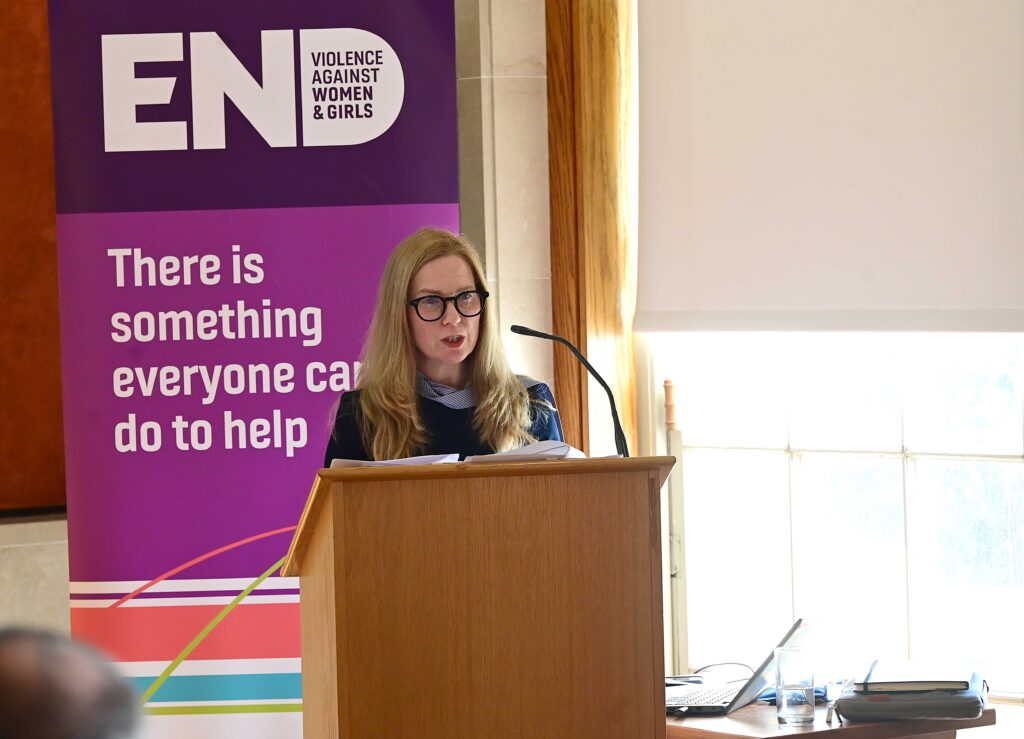 Professor Maria Lohan from Queen's University Belfast speaking at the launch of research into masculinity and attitudes towards violence against women and girls in Northern Ireland
