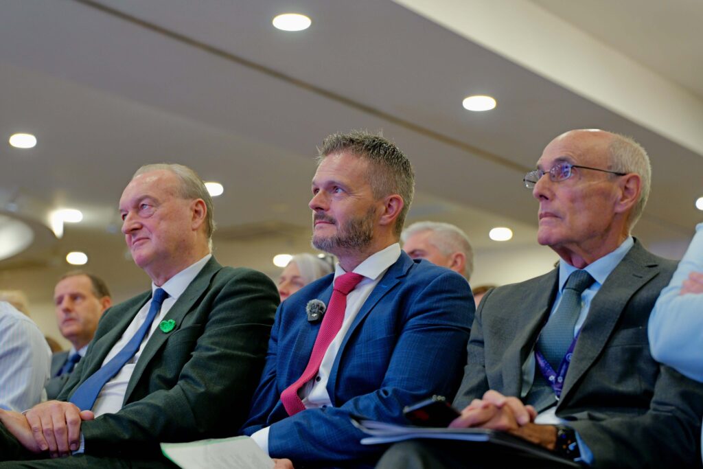 Health Minister Robbie Butler with Mike Farrar and Professor Rafael Bengoa at NICON26 in Belfast